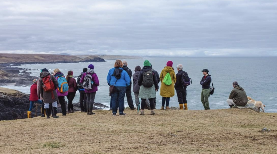 Group of people on a Landstory Tour on the coast