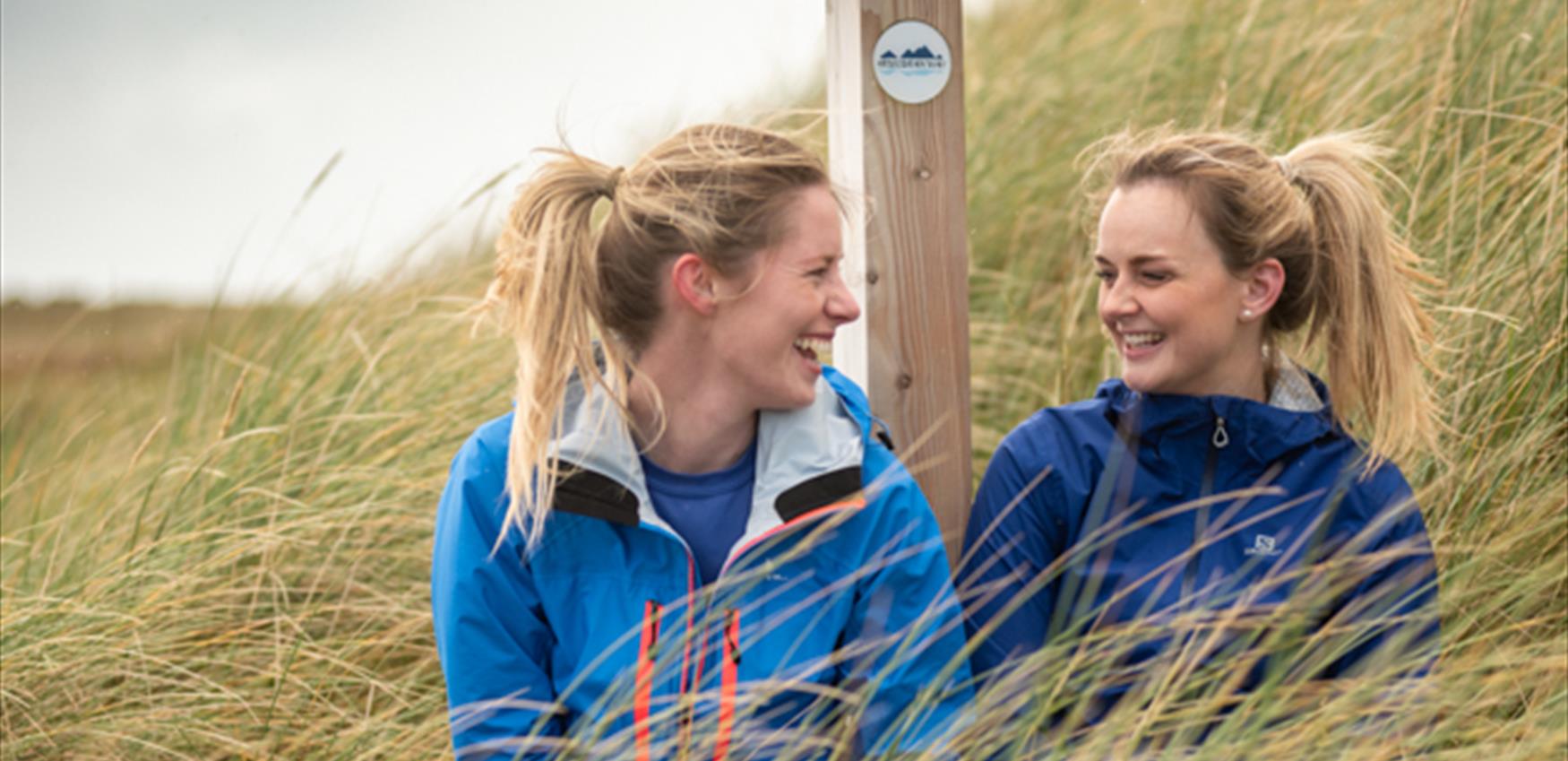 Two females at Hebridean Way wayfinder