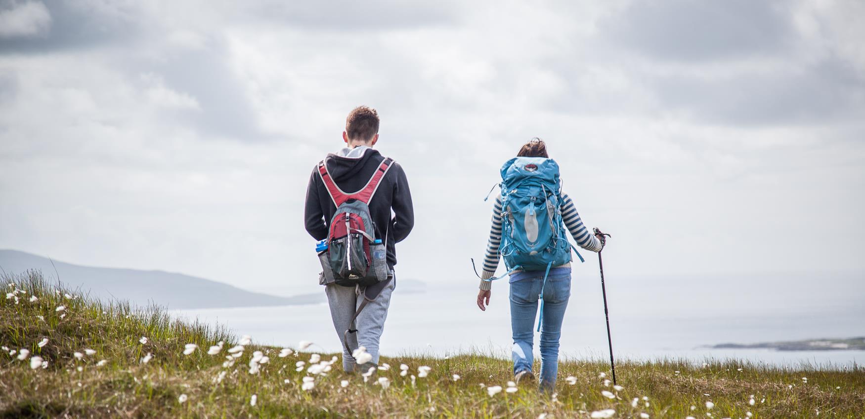 Walkers on hill in Harris