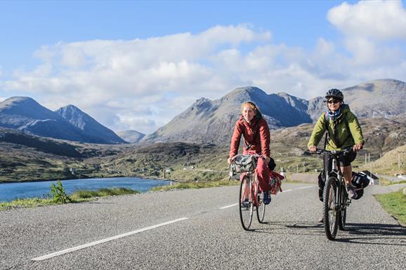 Harris: cyclists at Ardhasaig with Clisham backdrop