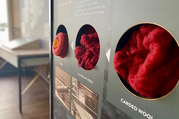 The Harris Tweed® Story Room stages to make yarn