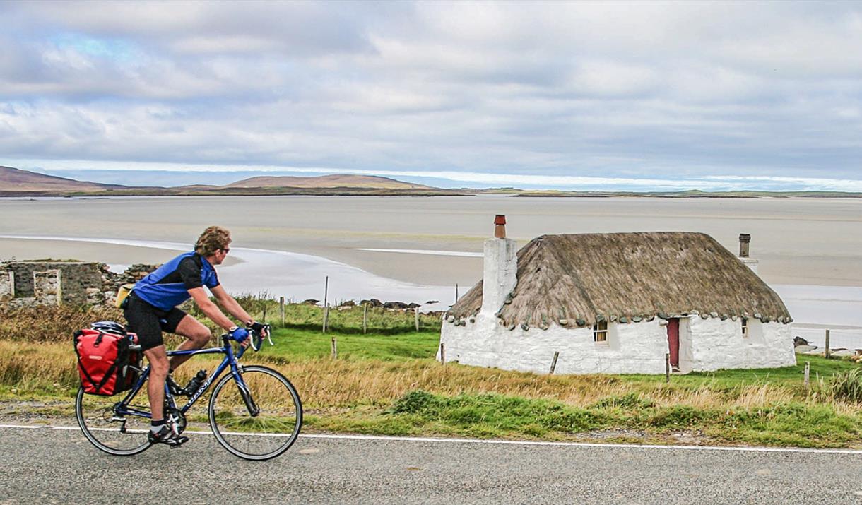 Cyclist at Sollas Cottage, Noorth Uist