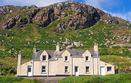 Cliff Cottage with hill in background