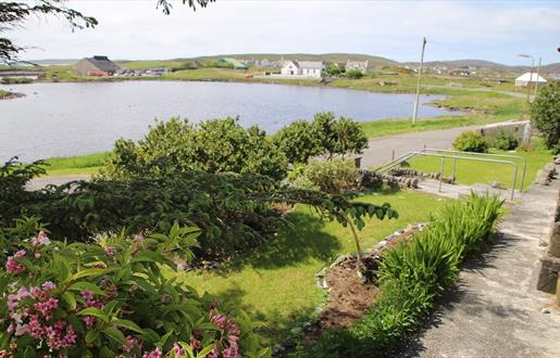 Lingay House garden with loch view