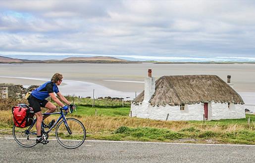 Cyclist at Sollas Cottage, Noorth Uist