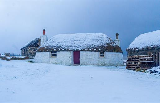 Thatched cottage in the snow