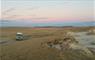 Tigharry Schoolhouse truck parked beside sand dunes