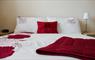 Lily Pond Cottage red & white bed
