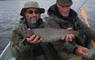 South Uist Fishing 2 men in a boat with trout