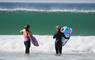 The Beach House 2 surfers in the sea