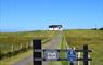 Tigh Geal gate and road to house
