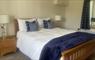 The Mission House at Mulag House double bed with blue throw & cushions