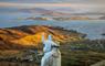 Our Lady Star of the Sea statue stands on a hill, with a scenic view of the sea on the Isle of Barra.
