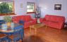Laxdale Holiday Park lounge with red sofas