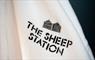 The Sheep Station - House Two logo on towels