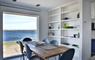 The Tidal House dining table with sea view
