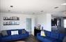 The Tidal House lounge with blue sofas