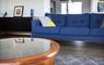 The Tidal House lounge with blue sofa