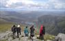 Hidden Hebrides group of people standing on top of a mountain