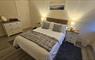 Main bedroom Heisgeir View Holiday Cottage with TV and en-suite shower room.
