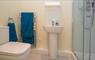 Heisgeir View ensuite bathroom with shower and heated towel rail.