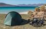Ticket To Ride bike and tent at beach