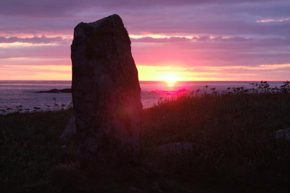 Standing Stone at Polochar by Gary Faux at sunset