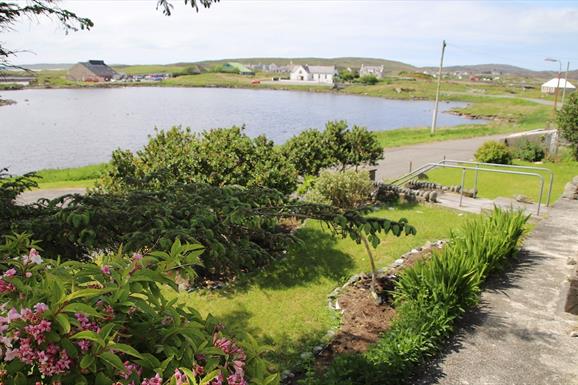 Lingay House garden with loch view