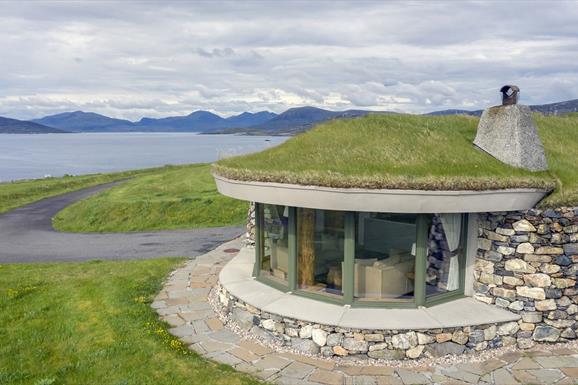 Blue Reef Cottages stone house with grass roof