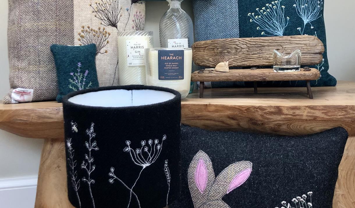 Various craft goods. Harris Tweed cushions, Harris Tweed Lampshades and Isle of Harris Gin candles Various craft goods. Harris Tweed cushions, Harris Tweed Lampshades and Isle of Harris Gin candles