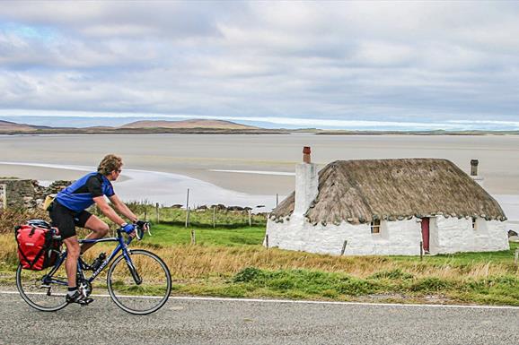 Cyclist at Sollas Cottage, Noorth Uist